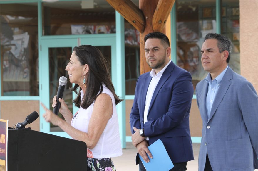 U.S. Rep. Teresa Leger Fernandez, left, is flanked by Democratic Congressmen Gabe Vasquez, of New Mexico, and Pete Aguilar, of California, as she speaks during a news conference in Albuquerque, N.M., Tuesday, Aug. 13, 2024. (AP Photo/Susan Montoya Bryan) ** FILE **