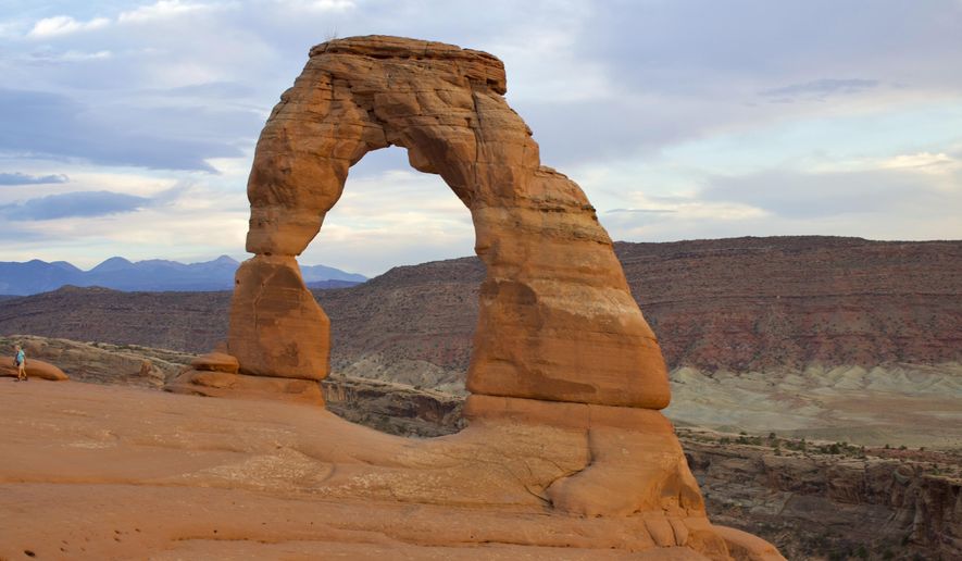 Delicate Arch, the most widely recognized of Utah's more than 6,000 natural arches, is seen in Arches National Park near Moab, Sept. 22, 2020. (AP Photo/Hannah Schoenbaum)