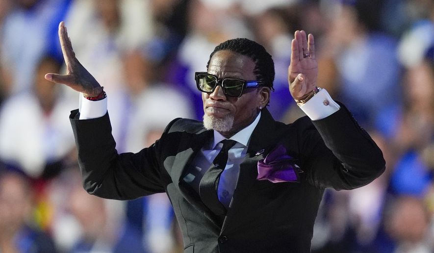 D.L. Hughley speaks during the Democratic National Convention Thursday, Aug. 22, 2024, in Chicago. (AP Photo/Charles Rex Arbogast)