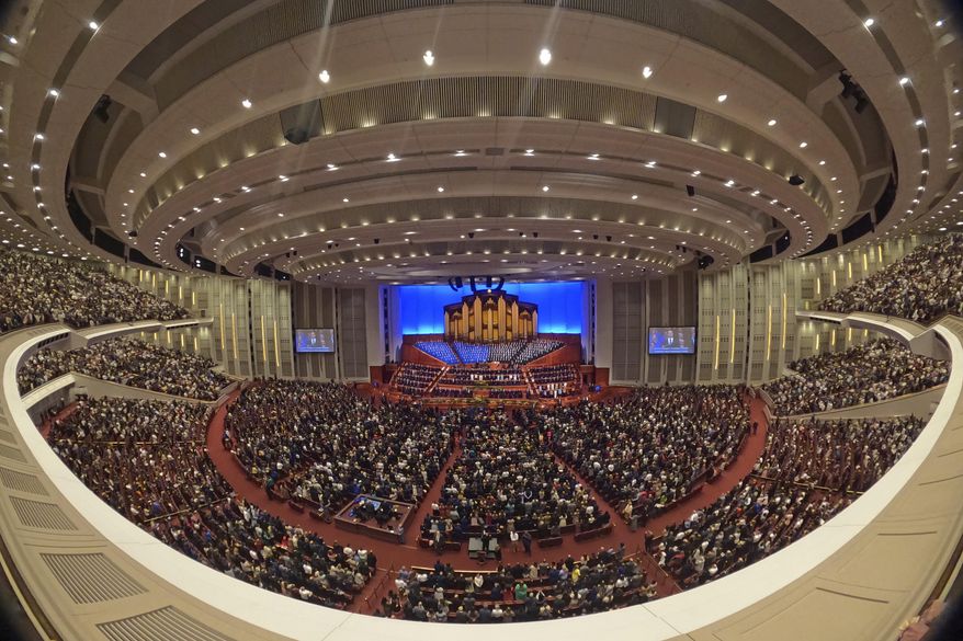 This image made with a fisheye lens shows people attending the twice-annual conference of the Church of Jesus Christ of Latter-day Saints, on April 7, 2024, in Salt Lake City. (AP Photo/Rick Bowmer, File)