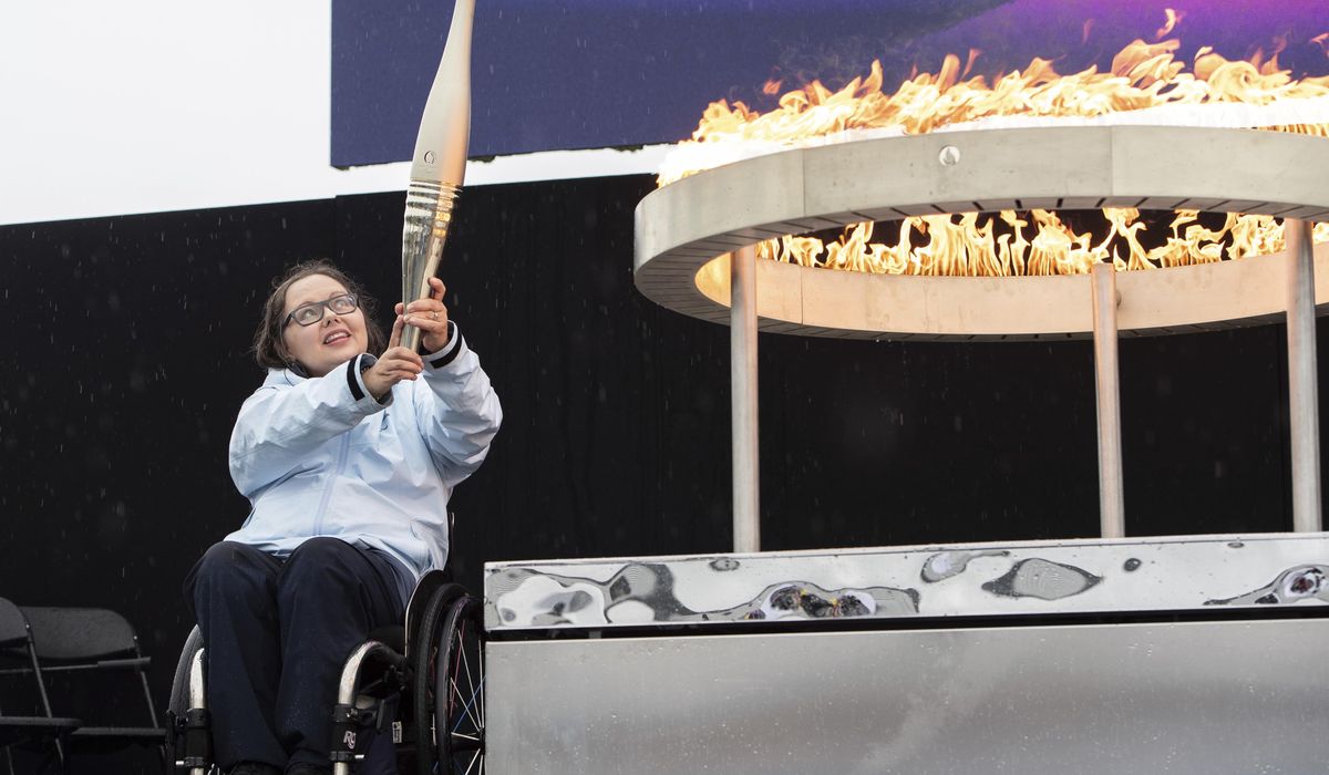 NextImg:Under sea and over land, the Paris Paralympics flame is lit before beginning an exceptional journey