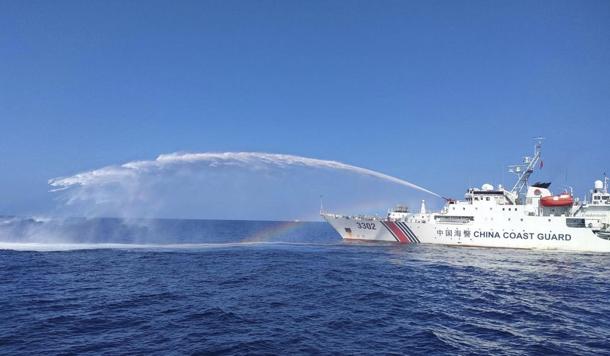 NextImg:Chinese coast guard ships fire water cannons and block Philippine fisheries vessel in disputed sea