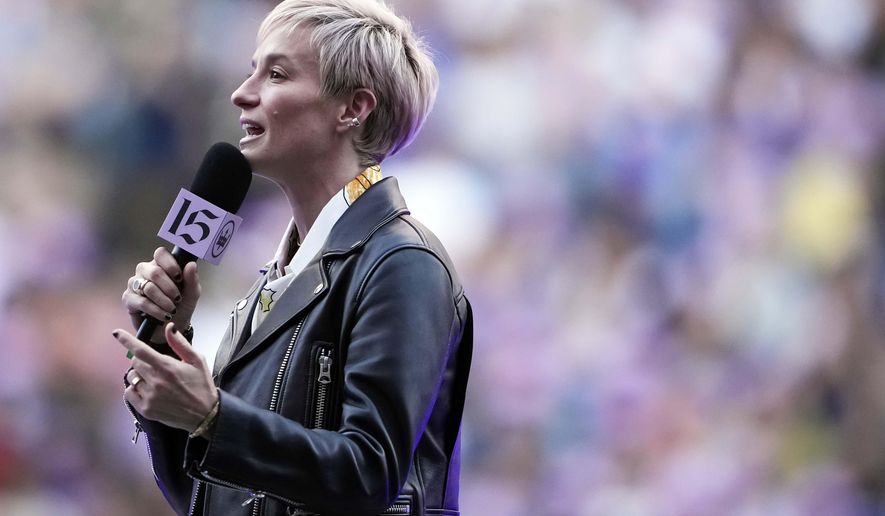 Former Seattle Reign forward Megan Rapinoe speaks during a ceremony to retire her jersey before an NWSL soccer match against the North Carolina Courage, Sunday, Aug. 25, 2024, in Seattle. (AP Photo/Lindsey Wasson)