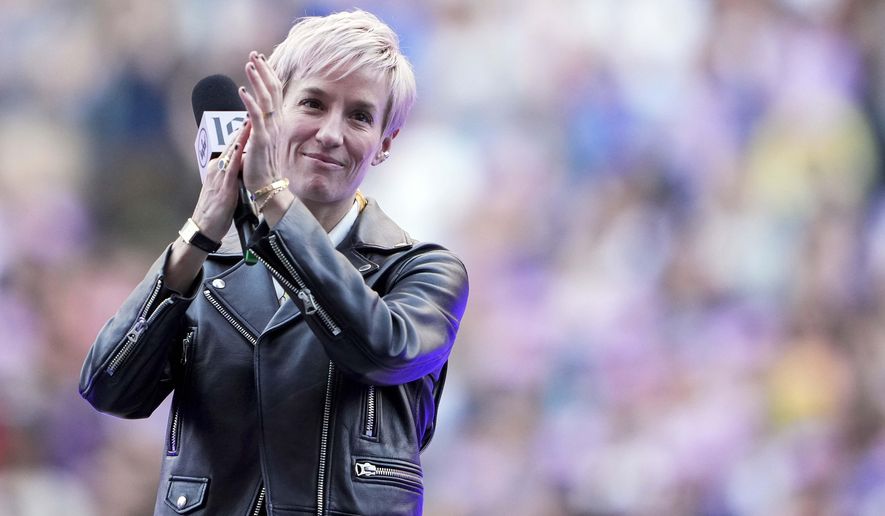 Former Seattle Reign forward Megan Rapinoe claps during a ceremony to retire her jersey before an NWSL soccer match against the North Carolina Courage, Sunday, Aug. 25, 2024, in Seattle. (AP Photo/Lindsey Wasson) **FILE**