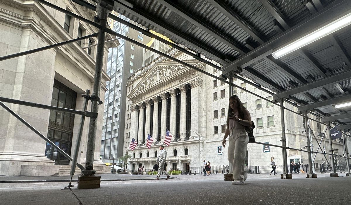 NextImg:Wall Street wavers as the Dow hovers around its record high