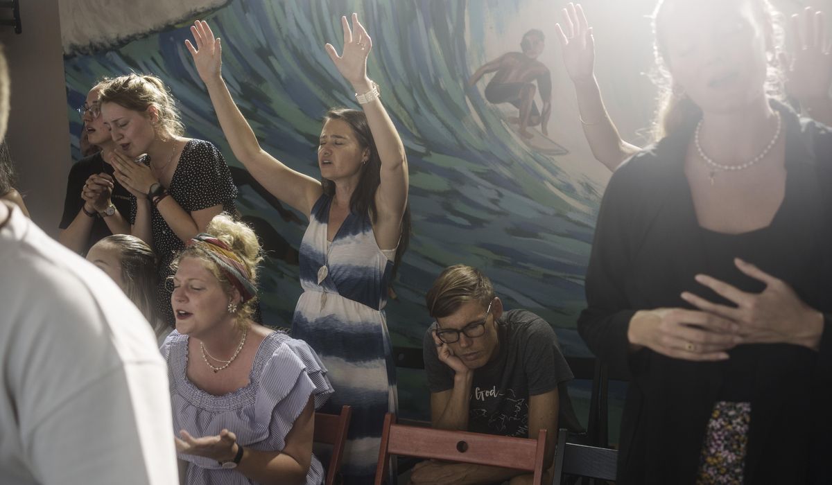 NextImg:At this church in Portugal, parishioners surf before they worship