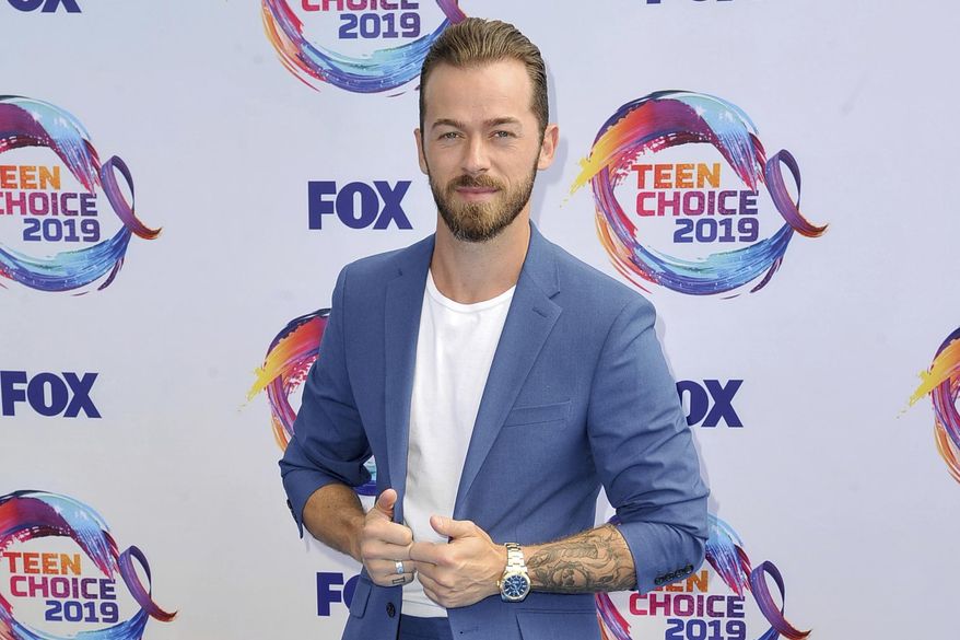 Artem Chigvintsev arrives at the Teen Choice Awards on Sunday, Aug. 11, 2019, in Hermosa Beach, Calif. (Photo by Richard Shotwell/Invision/AP, File)