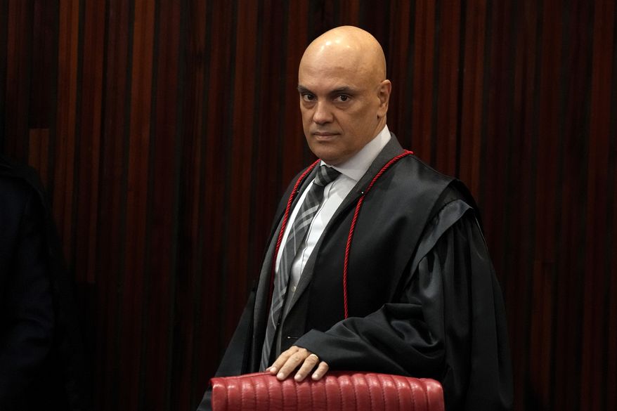 FILE - Brazilian Supreme Court Chief Justice Alexandre de Moraes arrives for a court hearing, in Brasilia, Brazil, June 22, 2023. (AP Photo/Eraldo Peres, File)