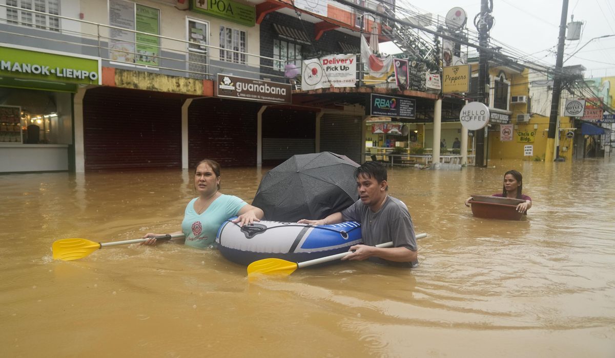 NextImg:Storm sets off deadly floods and landslides in Philippines