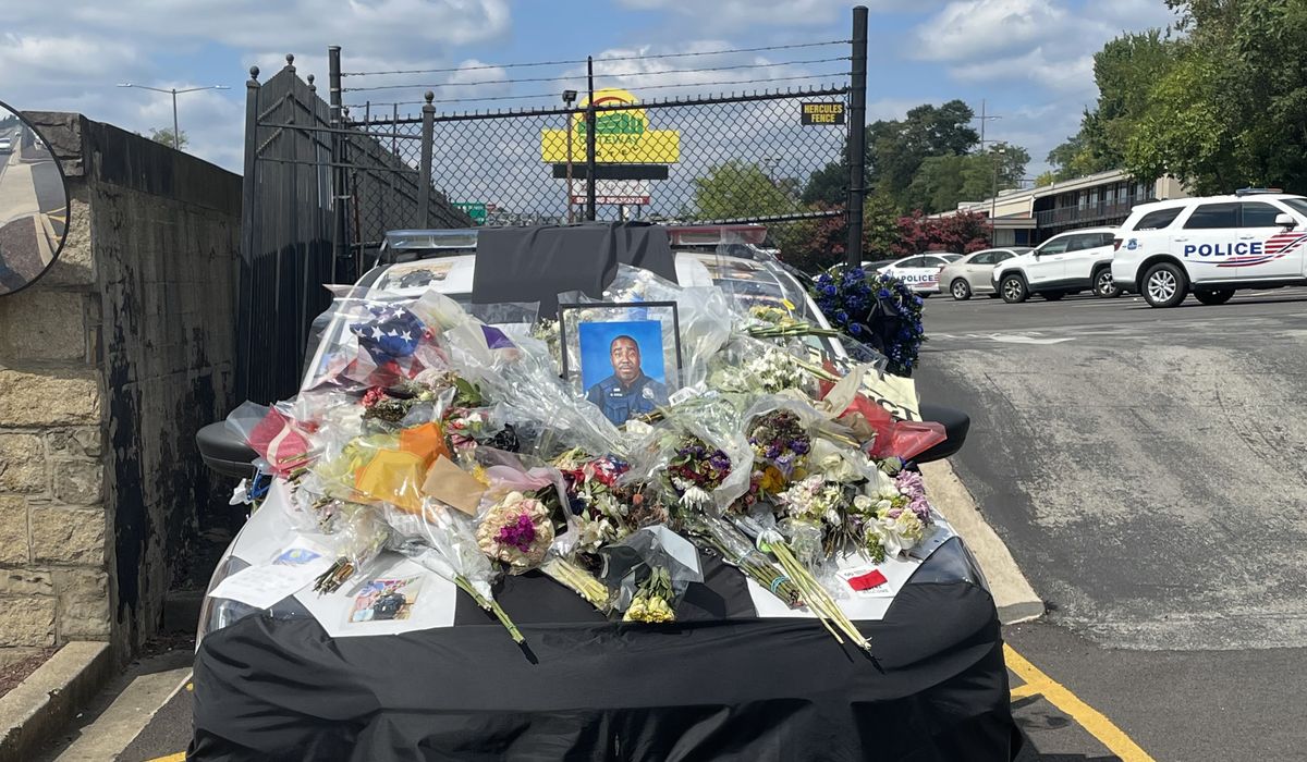 NextImg:Parked patrol car of slain D.C. officer becomes an impromptu memorial to his life