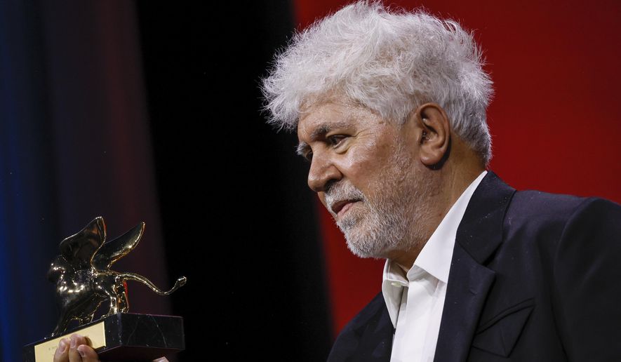 Pedro Almodovar, winner of the golden lion for best film for 'The Room Next Door', poses for photographers during the awards ceremony of the 81st edition of the Venice Film Festival in Venice, Italy, on Saturday, Sept. 7, 2024. (Photo by Joel C Ryan/Invision/AP)