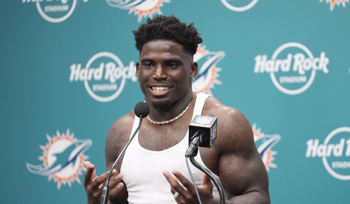 NextImg:Tyreek Hill is detained by police before Dolphins game. Officer is subsequently placed on leave