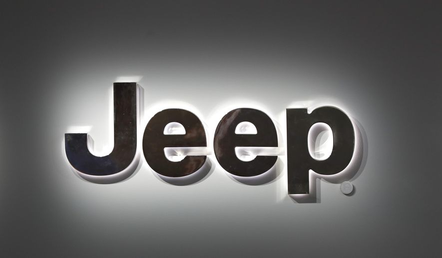 A Jeep logo is displayed at the North American International Auto Show in Detroit, Jan. 14, 2019. (AP Photo/Paul Sancya, File)