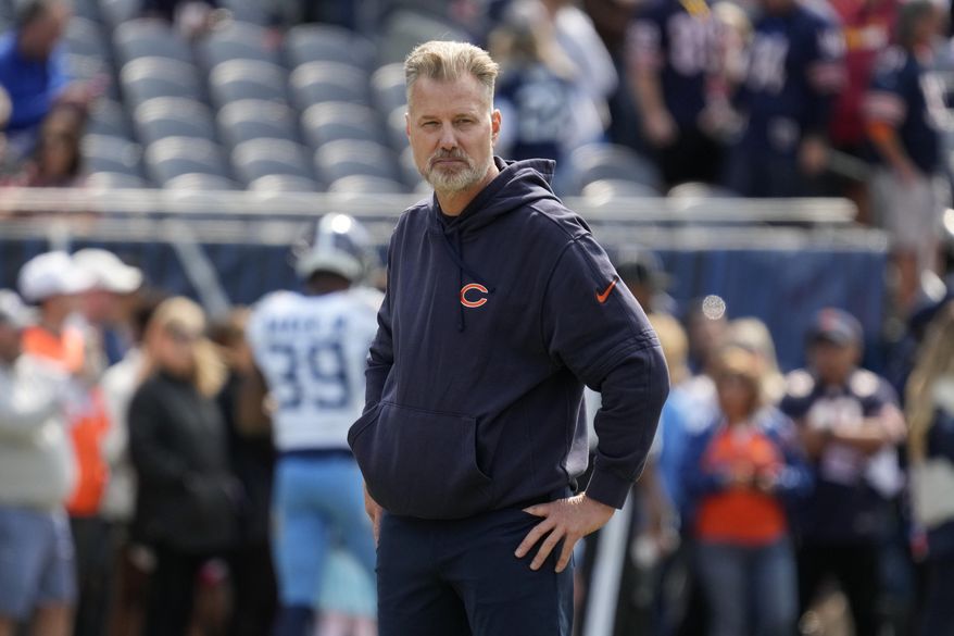 Chicago Bears head coach Matt Eberflus watches his team warm up before an NFL football game against the Tennessee Titans on Sunday, Sept. 8, 2024, in Chicago. (AP Photo/Nam Y. Huh)