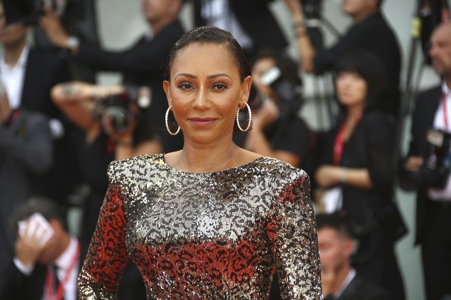 FILE - Singer Mel B poses for photographers upon arrival at the premiere of the film 'The Truth' and the opening gala of the 76th edition of the Venice Film Festival, Venice, Italy, on Aug. 28, 2019. Former Spice Girl Mel B is among dozens of Black Britons urging Britain's Parliament to update the country's equality laws and prohibit Afro hair discrimination. (Photo by Joel C Ryan/Invision/AP, File)