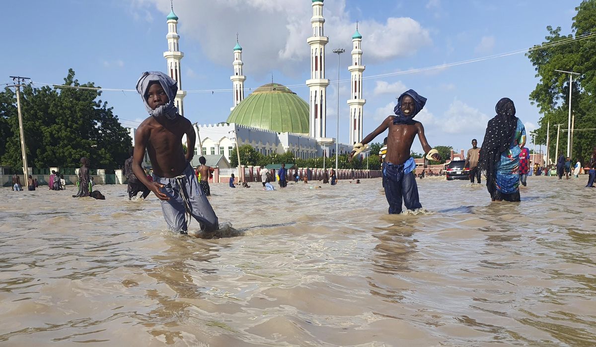 NextImg:‘Water is flooding everywhere’ as torrential rains sweep through West and Central Africa