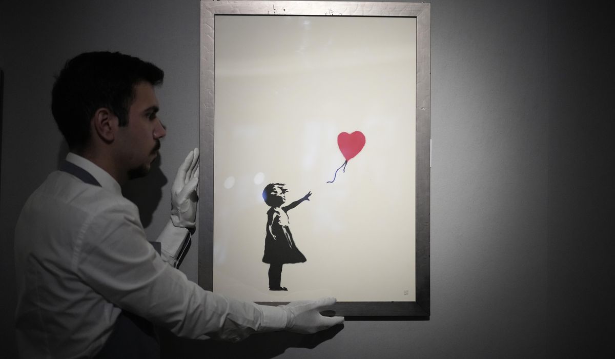 NextImg:Two men charged with stealing a famous Banksy image from a London art gallery