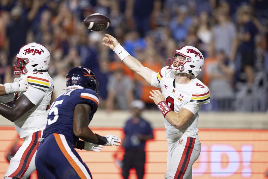 Maryland quarterback Billy Edwards Jr. (9) throws the ball against Virginia during the first half of an NCAA college football game, Saturday, Sept. 14, 2024, in Charlottesville, Va. (AP Photo/Mike Kropf)