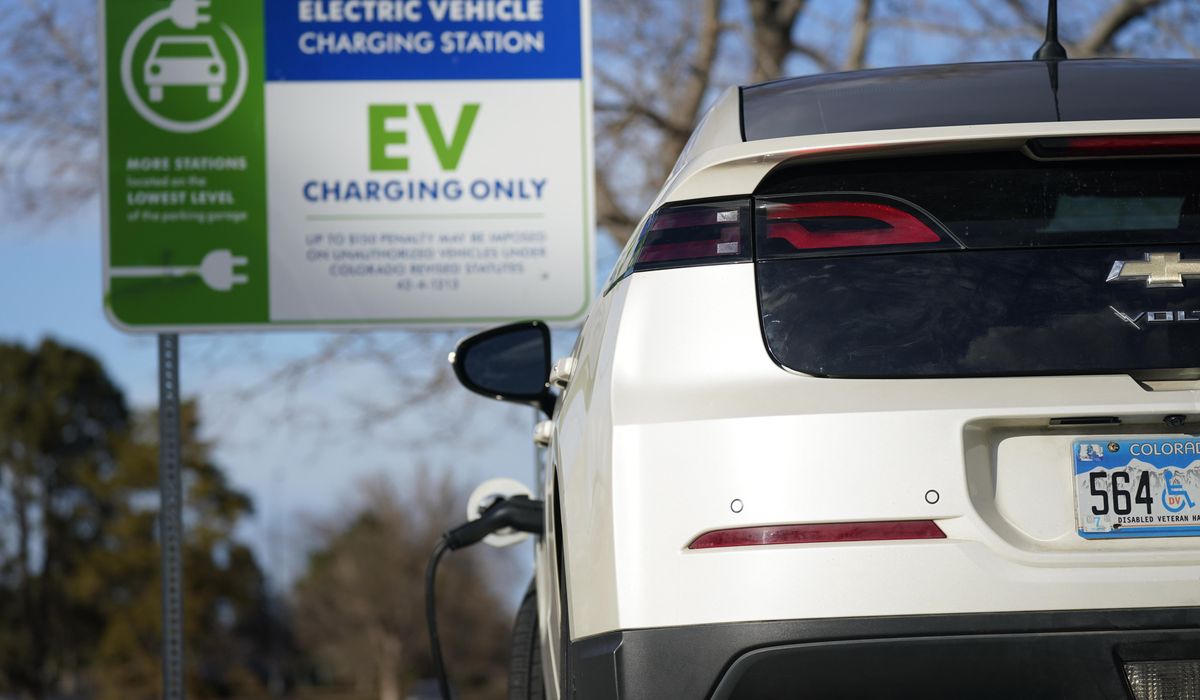 NextImg:GM offering adapters to help electric vehicle owners access Tesla chargers