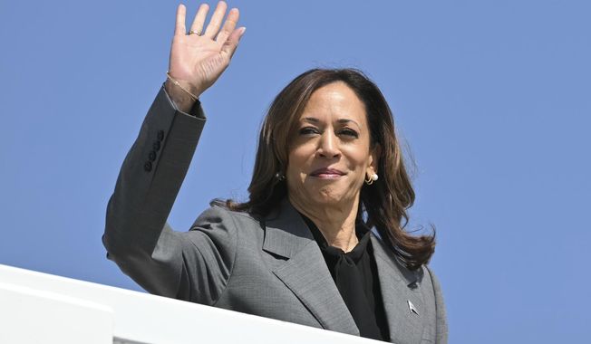 Democratic presidential nominee Vice President Kamala Harris waves as she boards Air Force Two, Friday, Sept. 20, 2024 at Joint Base Andrews, Md. Harris is traveling to Georgia for a campaign event. (Mandel Ngan/Pool via AP)