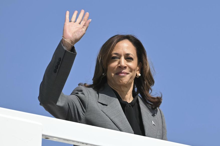 Democratic presidential nominee Vice President Kamala Harris waves as she boards Air Force Two, Friday, Sept. 20, 2024 at Joint Base Andrews, Md. Harris is traveling to Georgia for a campaign event. (Mandel Ngan/Pool via AP)