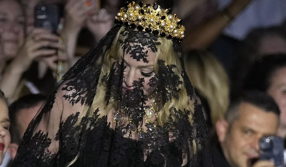 NextImg:Madonna sits front row at Dolce&Gabbana for show celebrating her 1990s heyday