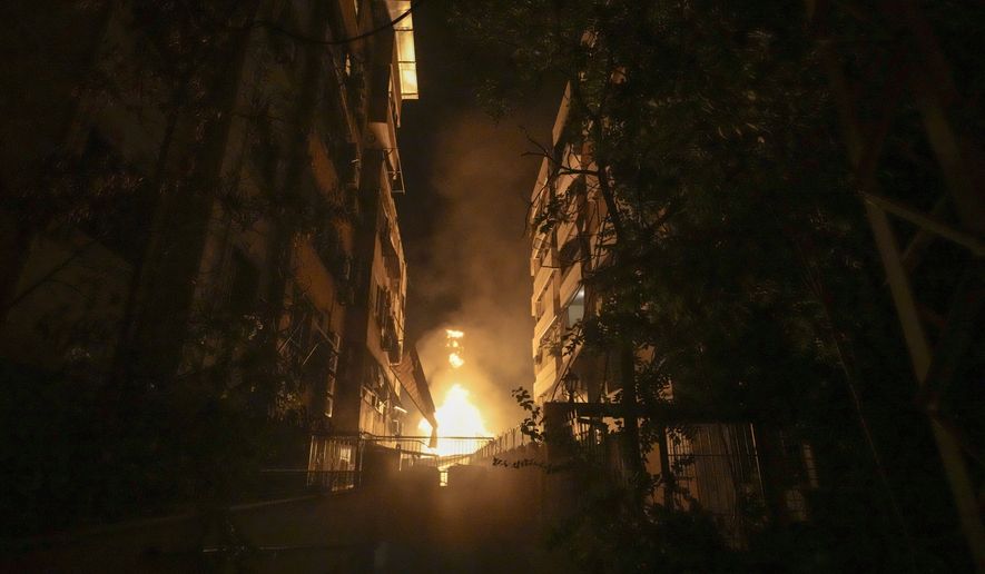 A fire burns at the site of an Israeli airstrike in Beirut's southern suburbs Friday, Sept. 27, 2024. (AP Photo/Bilal Hussein)