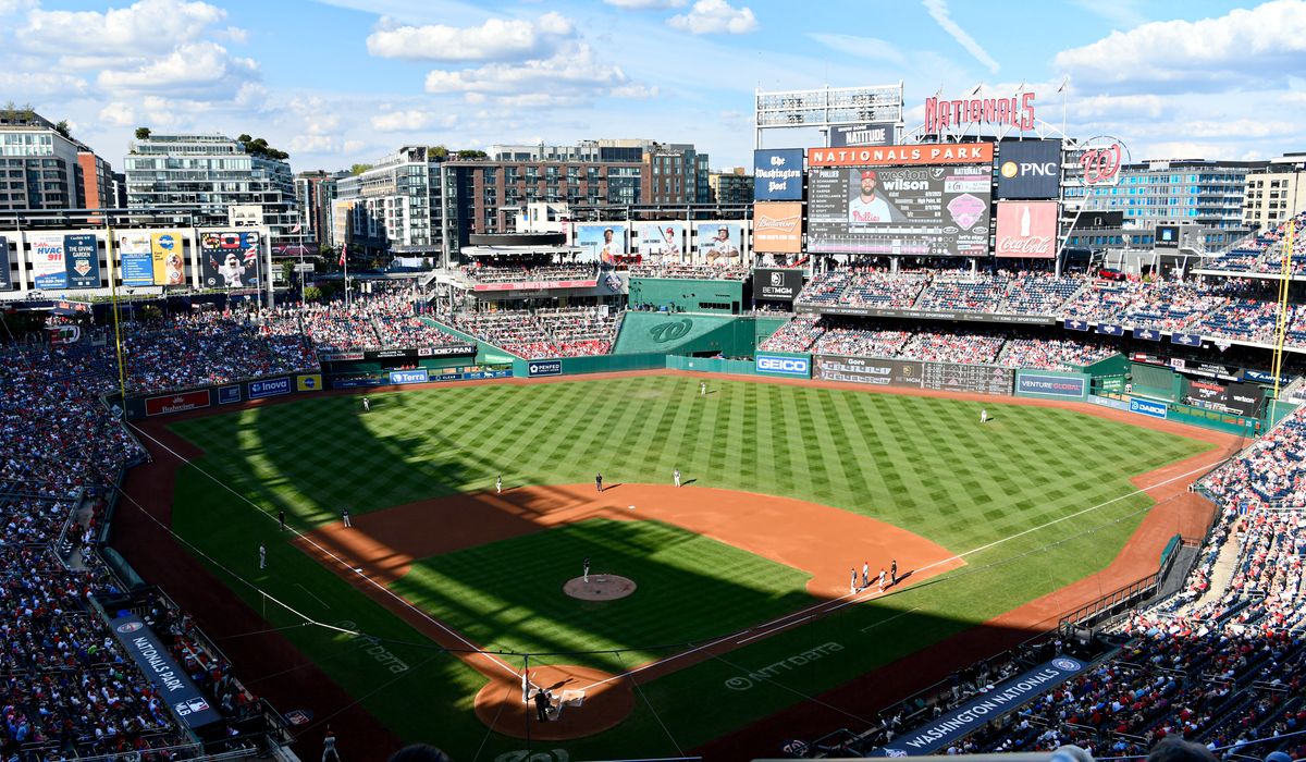 NextImg:Stressed federal workers seek comfort of baseball, hot dogs and cold brews amid uncertain futures