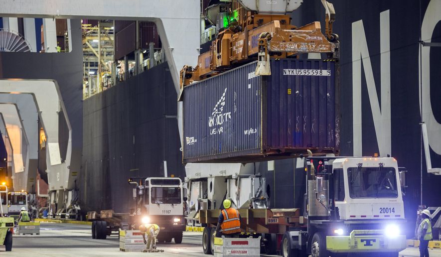 FILE - Five ship to shore cranes and gangs of longshoremen work the container ship YM Witness at the Georgia Ports Authority's Port of Savannah, Sept. 29, 2021, in Savannah, Ga. (AP Photo/Stephen B. Morton, File)