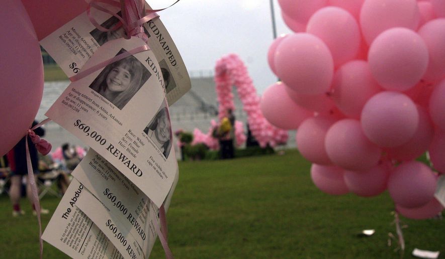 Notices of the kidnapping of Morgan Nick hang from balloons during the One Hope 2000 ceremony in Alma, Ark., June 3, 2000. (AP Photo/April L. Brown, File)