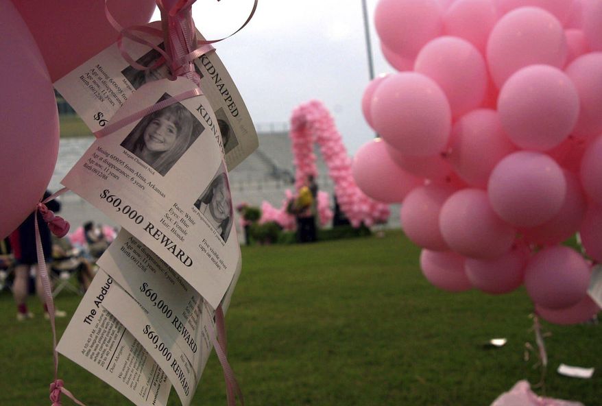 Notices of the kidnapping of Morgan Nick hang from balloons during the One Hope 2000 ceremony in Alma, Ark., June 3, 2000. (AP Photo/April L. Brown, File)