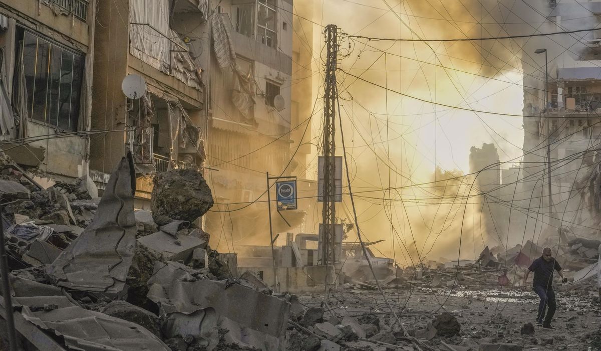 NextImg:Israeli airstrikes rock southern suburbs of Beirut and cut off a key crossing into Syria