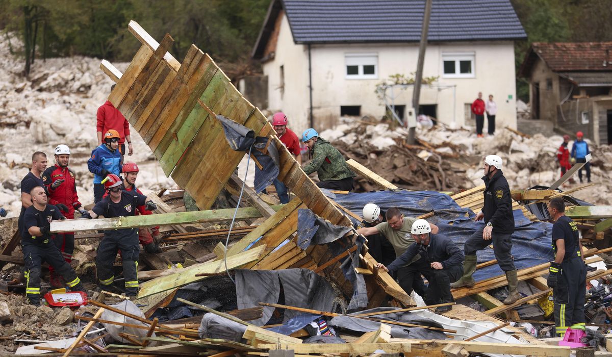 NextImg:Rescue teams look for missing after floods, landslides kill at least 16 in Bosnia