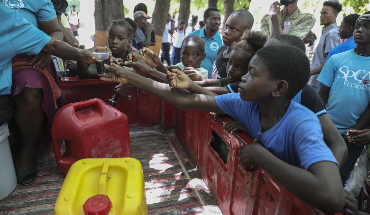 NextImg:Over 6,000 people in Haiti leave their homes after gang attack killed dozens