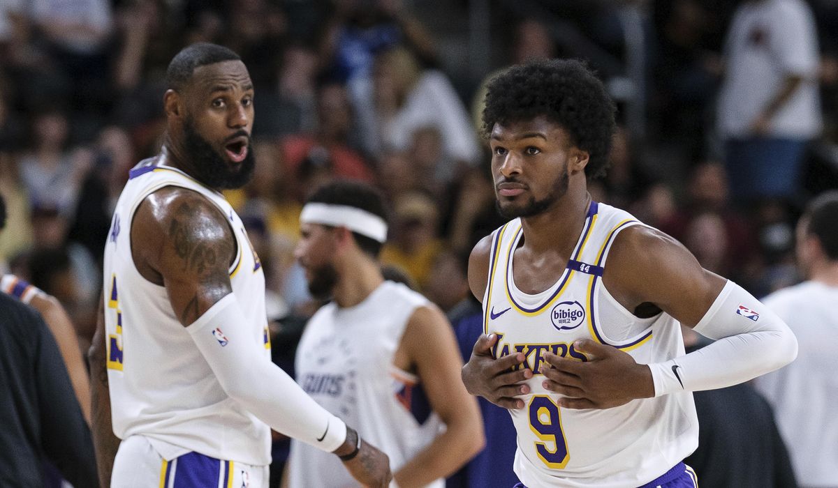 NextImg:LeBron and son Bronny James play together for the first time in a preseason game for the Lakers