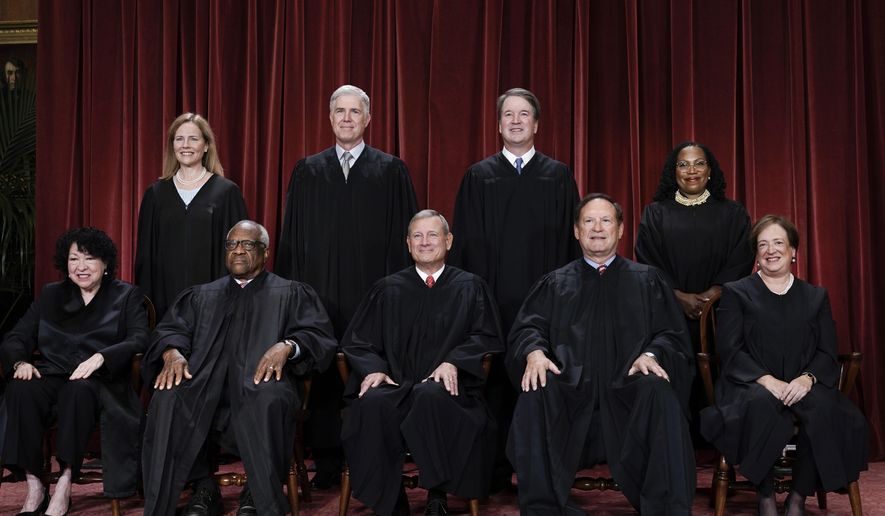 Members of the Supreme Court sit for a new group portrait following the addition of Associate Justice Ketanji Brown Jackson, at the Supreme Court building in Washington, Oct. 7, 2022. Bottom row, from left, Associate Justice Sonia Sotomayor, Associate Justice Clarence Thomas, Chief Justice of the United States John Roberts, Associate Justice Samuel Alito, and Associate Justice Elena Kagan. Top row, from left, Associate Justice Amy Coney Barrett, Associate Justice Neil Gorsuch, Associate Justice Brett Kavanaugh, and Associate Justice Ketanji Brown Jackson. (AP Photo/J. Scott Applewhite, File)