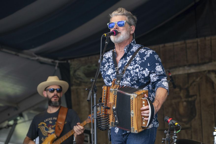 Steve Riley of Steve Riley and the Mamou Playboys performs during the New Orleans Jazz & Heritage Festival Saturday, May 4, 2024, at the Fair Grounds Race Course in New Orleans. (Photo by Amy Harris/Invision/AP, File)