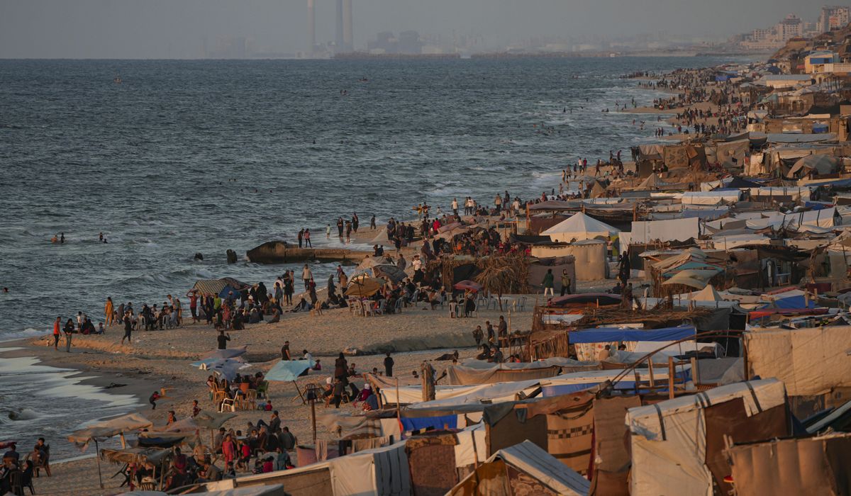 NextImg:Palestinian officials say an Israeli strike on a Gaza shelter has killed at least 23 people