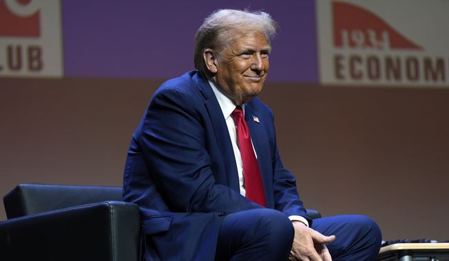 Republican presidential nominee former President Donald Trump listens as he answers questions at a meeting of the Detroit Economic Club, Thursday, Oct. 10, 2024, in Detroit. (AP Photo/Julia Demaree Nikhinson)