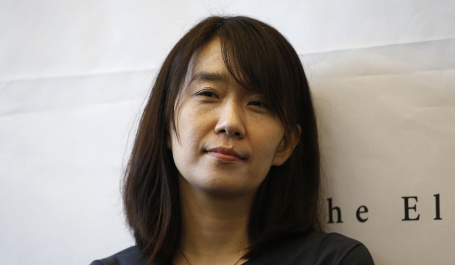 South Korean author Han Kang poses for the media during a news conference in Seoul, South Korea, Tuesday, May 24, 2016. Kang has won the Nobel Prize for Literature. (AP Photo/Lee Jin-man, File)