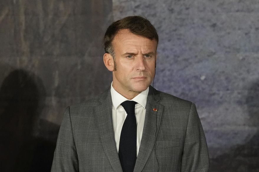 French President Emmanuel Macron, listens during a news press conference in Paphos ,Cyprus, on Friday, Oct 11, 2024 as the leaders of nine southern European Union member countries and Jordan are meeting to come up with ways of de-escalating the conflict in the Middle East (AP Photo/Petros Karadjias)