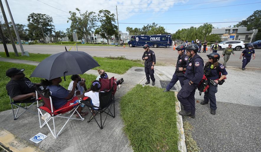 FEMA officials talk to residents displaced from their apartment complex during Hurricane Milton in Clearwater, Fla., on Friday, Oct. 11, 2024. (AP Photo/Julio Cortez) **FILE**