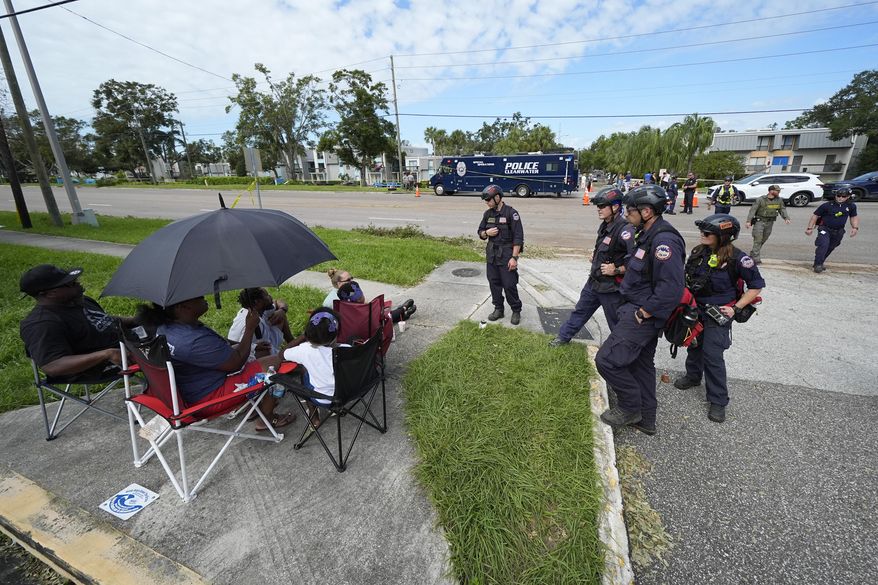FEMA officials talk to residents displaced from their apartment complex during Hurricane Milton in Clearwater, Fla., on Friday, Oct. 11, 2024. (AP Photo/Julio Cortez) **FILE**