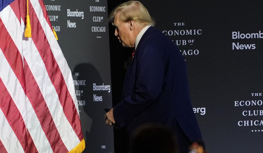 Republican presidential nominee former President Donald Trump walks off after an interview with Bloomberg News Editor-in-Chief John Micklethwait during an event with the Economic Club of Chicago, Tuesday, Oct. 15, 2024, in Chicago. (AP Photo/Evan Vucci)