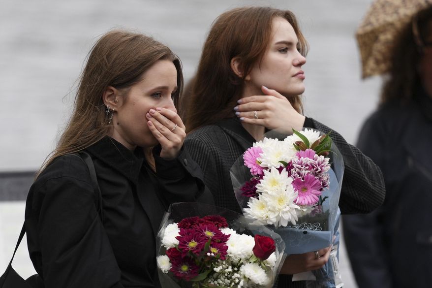 Fans gather for a vigil with flowers to pay tribute to late British singer Liam Payne, former member of the British pop band One Direction in Hyde Park in London, Sunday, Oct. 20, 2024, in London. (Photo by Scott A Garfitt/Invision/AP)