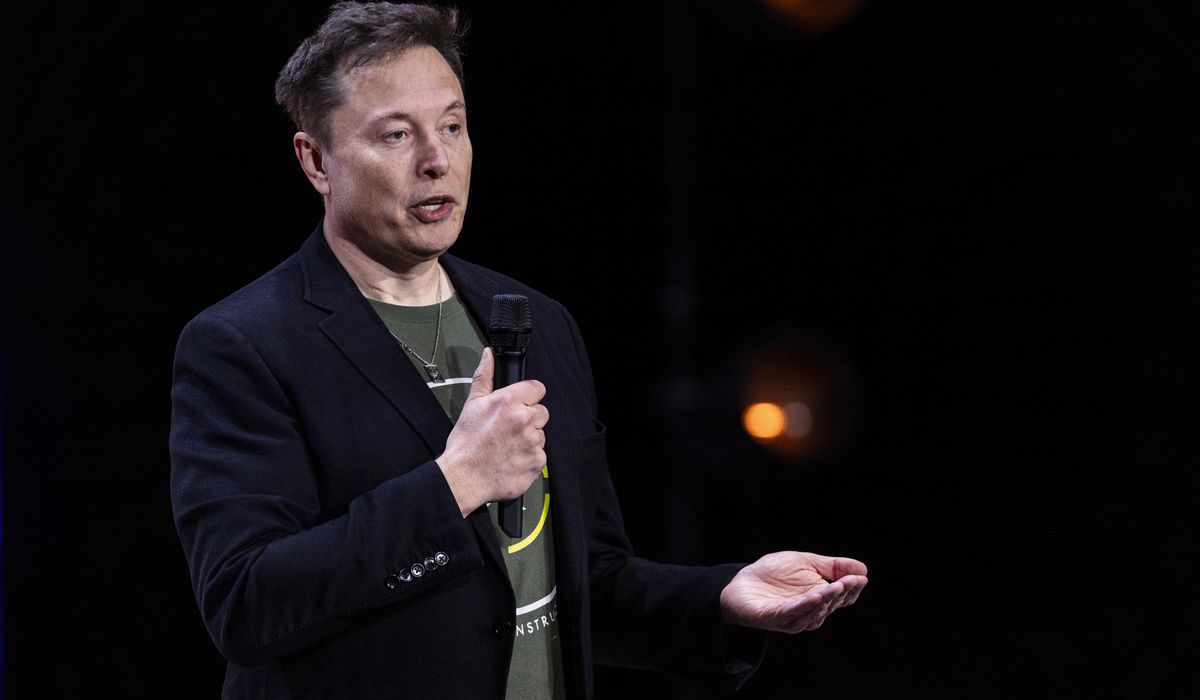 NextImg:Biden calls out Musk over a published report that the Tesla CEO once worked in the U.S. illegally