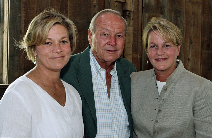 Arnold Palmer, center, is seen with his daughters, Peggy Palmer, left, of Durham, N.C., and Amy Saunders, of Orlando, Fla., inside the barn of the Winnie Palmer Nature Reserve, in Latrobe, Pa., during the dedication of the reserve June, 30, 2007. ( Kim Stepinsky/Pittsburgh Tribune-Review via AP, File)