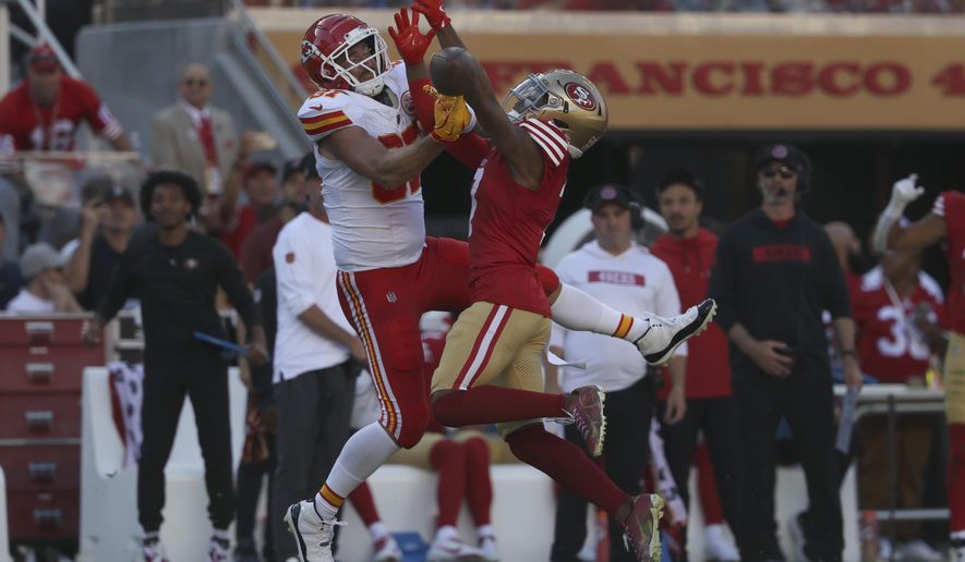 Kansas City Chiefs tight end Travis Kelce, left, cannot catch a pass while being defended by San Francisco 49ers cornerback Charvarius Ward during the second half of an NFL football game in Santa Clara, Calif., Sunday, Oct. 20, 2024. (AP Photo/Jed Jacobsohn)