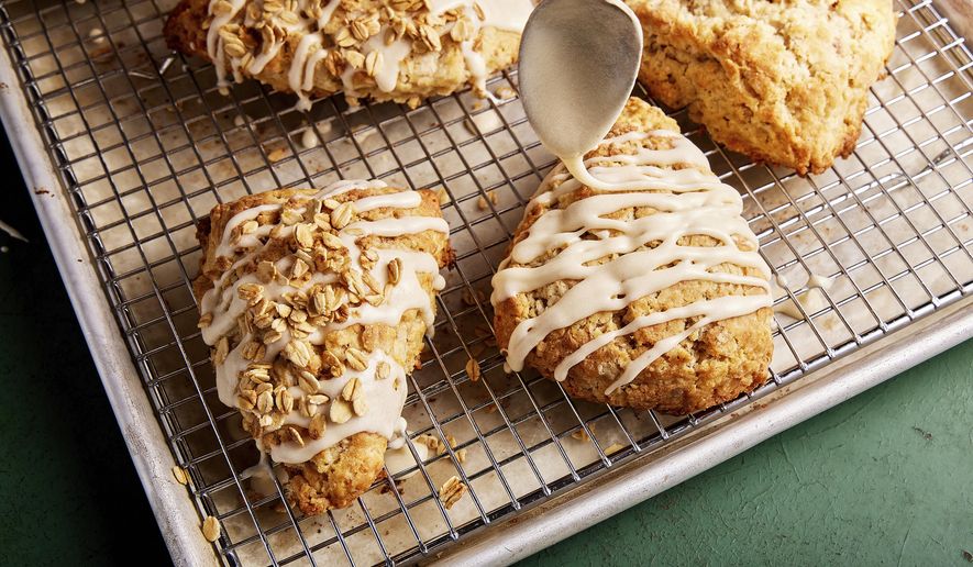 This image released by Milk Street shows a recipe for maple scones with toasted rolled oats. (Milk Street via AP)