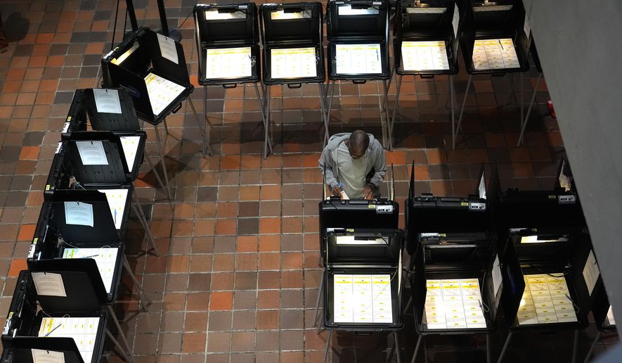 A person votes on the first day of early voting in the general election, Oct. 21, 2024, in Miami. (AP Photo/Lynne Sladky, File)